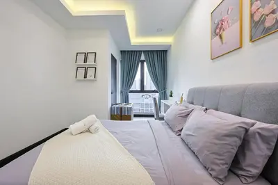 a small bedroom with a bed and a window at V Residence Sunway Velocity Kuala Lumpur by Vivid Stay in Kuala Lumpur