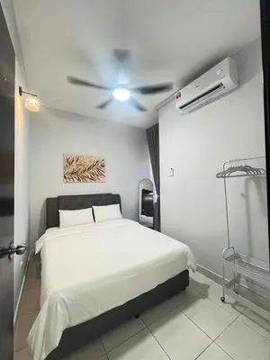 a bedroom with a white bed and a ceiling fan at Diamond Suite Homestay in Kuala Lumpur