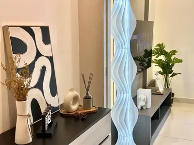 a room with a table with vases and paintings at 8 Pax Continew 2R2B Premium Amenities 10mins to KLCC TRX in Kuala Lumpur