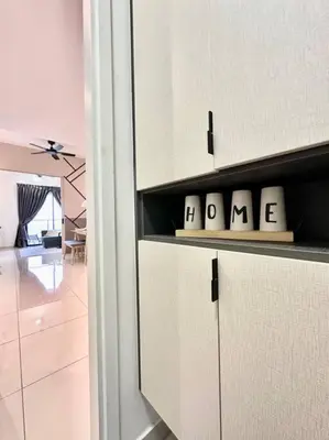 a kitchen with white cabinets with the wordarma on it at 8 Pax Continew 2R2B Premium Amenities 10mins to KLCC TRX in Kuala Lumpur