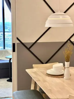 a dining room with a table with plates on it at 8 Pax Continew 2R2B Premium Amenities 10mins to KLCC TRX in Kuala Lumpur