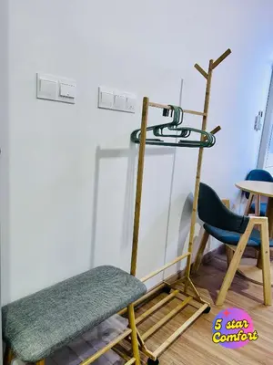 a ladder and a chair in a room at 5 Star Comfort Riveria City KL Sentral 4 pax infinity pool in Kuala Lumpur