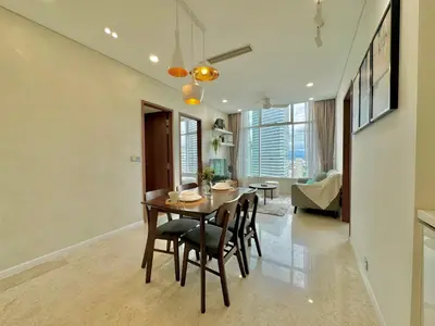 a dining room with a table and chairs at Sky Suites Wonder 2BR Suite KLCC View in Kuala Lumpur