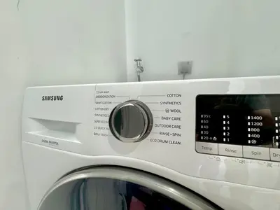 a washing machine with a timer on top of it at Sky Suites Wonder 2BR Suite KLCC View in Kuala Lumpur