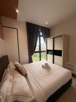a bedroom with a large bed with a window at Downtown Retreat 2BR at Neu Suites, Kuala Lumpur in Kuala Lumpur
