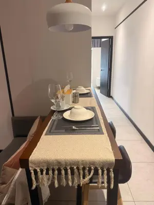 a dining room table with a plate on it at Downtown Retreat 2BR at Neu Suites, Kuala Lumpur in Kuala Lumpur