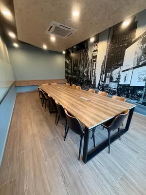a large conference room with a large wooden table and chairs at Downtown Retreat 2BR at Neu Suites, Kuala Lumpur in Kuala Lumpur