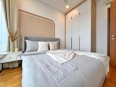 a bedroom with a large white bed with a large mirror at Sky Suites Upper 3BR Suite at KLCC in Kuala Lumpur
