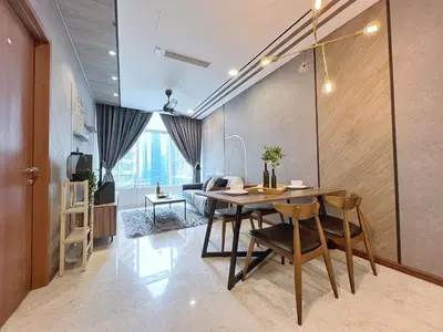a dining room with a table and chairs at Sky Suites Modern 3BR Family Suite at KLCC in Kuala Lumpur
