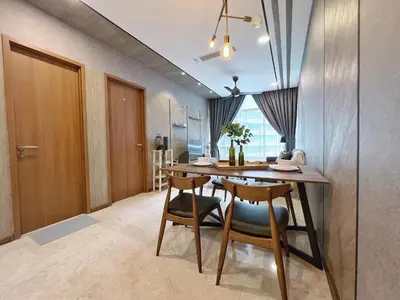 a dining room with a table and two chairs at Sky Suites Modern 3BR Family Suite at KLCC in Kuala Lumpur