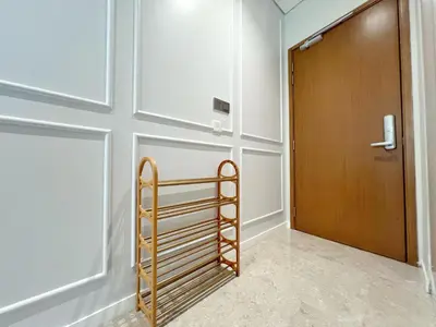 a room with a wooden door and a ladder at Sky Suites Unique 3BR Suite KLCC View in Kuala Lumpur