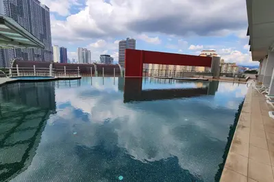 a large pool of water in a city with buildings at Désir Amorous KL #Jacuzzi #NFLX #Prjscn120