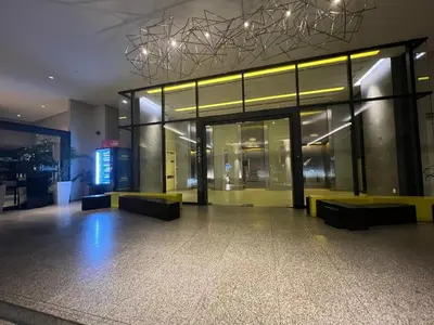 a lobby of a building with benches in front of it at City Centre Apartment in Kuala Lumpur