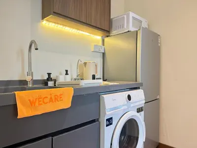 a kitchen with a washing machine and a sink at X - The Thomas Bangsar South Midvalley LRT Kerinchi in Kuala Lumpur