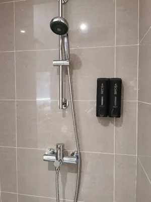 a shower in a bathroom with a shower head at X - The Thomas Bangsar South Midvalley LRT Kerinchi in Kuala Lumpur