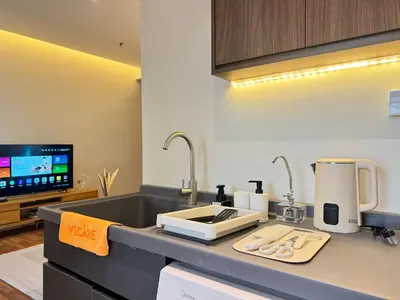 a kitchen with a counter top with a sink at X - The Thomas Bangsar South Midvalley LRT Kerinchi in Kuala Lumpur