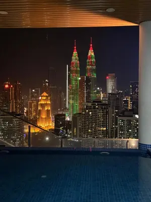 a view of a city skyline at night at KIcc view residences by the colony in Kuala Lumpur