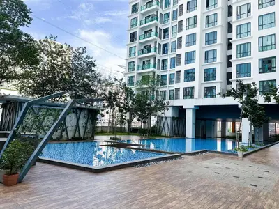 a swimming pool in front of a building at The Nest Residensi 357 Jalan Genting Kelang, Setapak KL by Idealhub in Kuala Lumpur