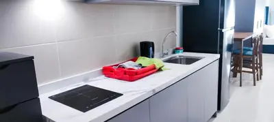 a kitchen counter with a red basket on it at The Nest Residensi 357 Jalan Genting Kelang, Setapak KL by Idealhub in Kuala Lumpur