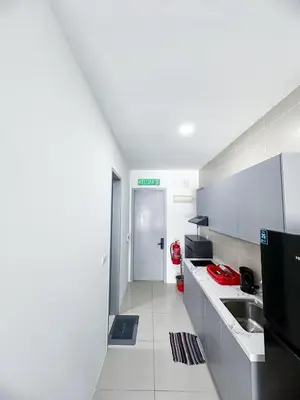a white kitchen with a sink and a counter top at The Nest Residensi 357 Jalan Genting Kelang, Setapak KL by Idealhub in Kuala Lumpur