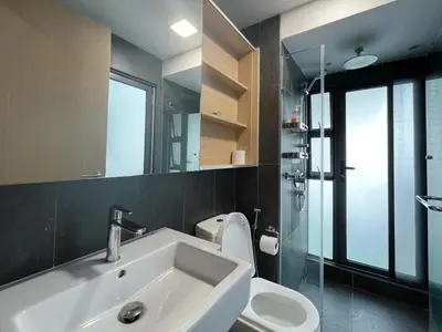 a bathroom with a sink and a toilet and a mirror at The colony by infinitum sweet home in Kuala Lumpur