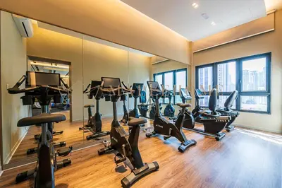 a gym with a bunch of treadmills and ellipticals at Agile Premier Suites Kuala Lumpur in Kuala Lumpur