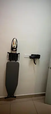 a gun on a wall next to a toilet at MH Platinum 2 Homestay 3Bedroom in Kuala Lumpur