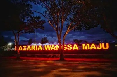 a neon sign that saysza war issa masu at night at MH Platinum 2 Homestay 3Bedroom in Kuala Lumpur