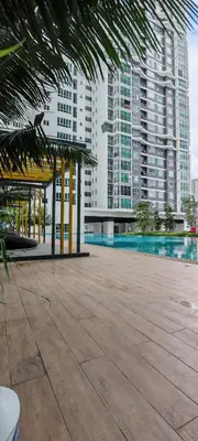 a large building with a swimming pool in front of it at MH Platinum 2 Homestay 3Bedroom in Kuala Lumpur