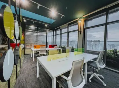 an office with tables and chairs and large windows at The Riv at Riveria City KL Sentral by Luxe n Comfy in Kuala Lumpur