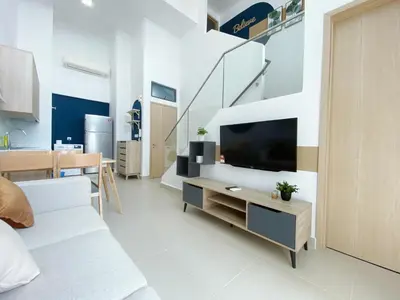 a living room with a tv and a couch at The Colony Infinitum By Happy Stay in Kuala Lumpur