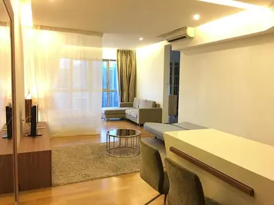a living room with a couch and a table at Regalia residency in Kuala Lumpur