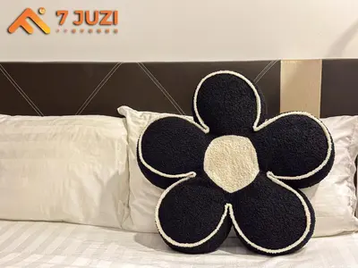 a black and white shamrock pillow on a bed at Premium&Cozy Studio small cinema KLCC InfinityPool in Kuala Lumpur