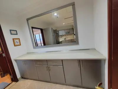 a bathroom counter with a mirror and a sink at Penthouse Duplex with KLCC Views At Times Square in Kuala Lumpur