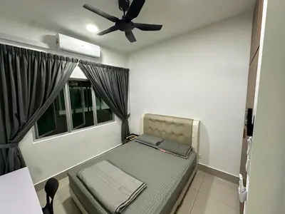 a small bed in a room with a ceiling fan at Razak City Residences in Kuala Lumpur