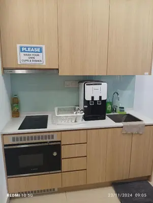 a kitchen with a sink and a coffee maker at The luxe suite service KLCC in Kuala Lumpur