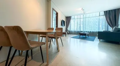 a living room with a table and chairs and a couch at Vortex KLCC Vibes in Kuala Lumpur