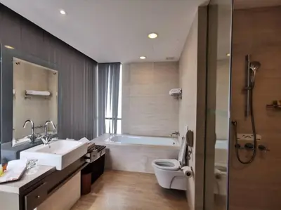 a bathroom with a tub and a sink and a toilet at St Giles Gardens Residences Kuala Lumpur in Kuala Lumpur