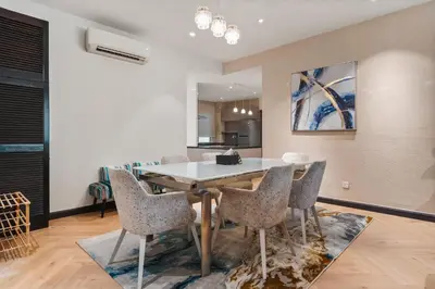 a kitchen and dining room with a table and chairs at Retreat In The Heart of KLCC, The Corinthians in Kuala Lumpur