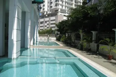 a swimming pool in the middle of a building at Retreat In The Heart of KLCC, The Corinthians in Kuala Lumpur
