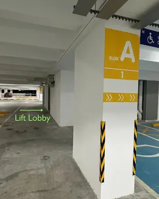 a parking garage with a life lobby sign on a pillar at 3 bedroom apt L21 in kl sentral with city view in Kuala Lumpur
