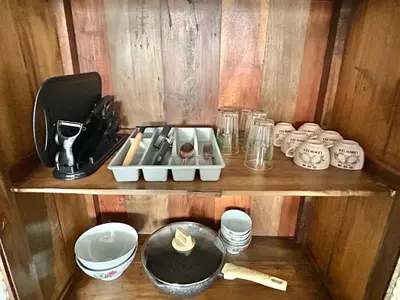 a wooden shelf with various items on it at 3 bedroom apt L26 at kl sentral with city view in Kuala Lumpur