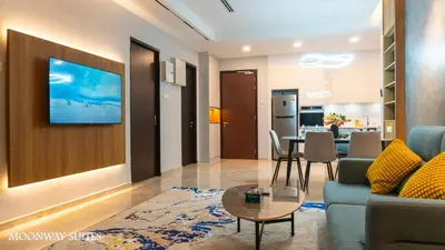 a living room with a couch and a table at Harmony Luxury Suites At TM Persiaran Stonor KLCC in Kuala Lumpur