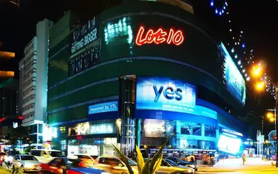 a building with a visa sign on it at night at Modern 2BR Fairlane Retreat Steps from Lot 10 in Kuala Lumpur