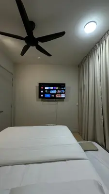 a bedroom with a bed with a ceiling fan at Datum Jelatek Superb Suite KL By LH in Kuala Lumpur
