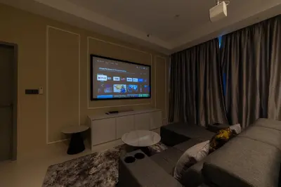 a living room with a couch and a flat screen tv at Novo Ampang KL near Gleneagles by Sleepy Bear in Kuala Lumpur