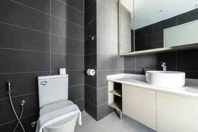 a bathroom with a white toilet and a sink at Novo Ampang KL near Gleneagles by Sleepy Bear in Kuala Lumpur