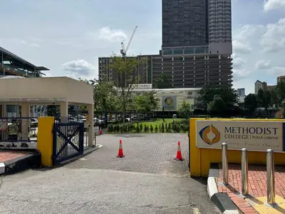 a sign for a met hospital with orange traffic cones at KL Sentral Monorail Infinity Sky Pool Family Suites -The RIV in Kuala Lumpur