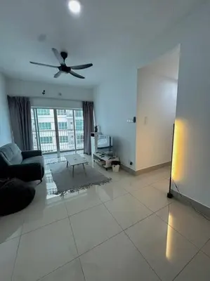 a living room with a couch and a ceiling fan at Rc Residences in Kuala Lumpur