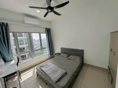 a bedroom with a bed and a ceiling fan at Rc Residences in Kuala Lumpur